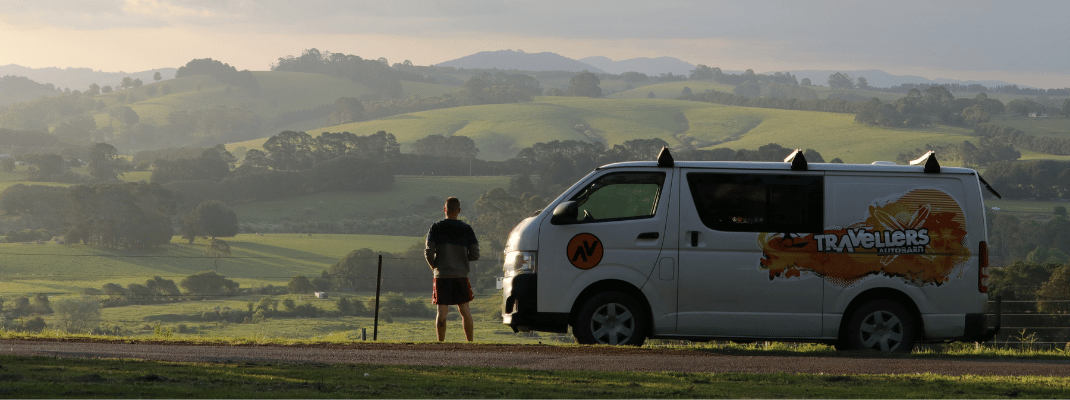 Campervan with view of rolling hills