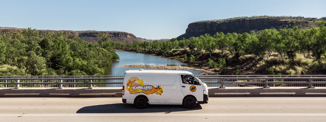Campervan on bridge above a river in the Northern Territory