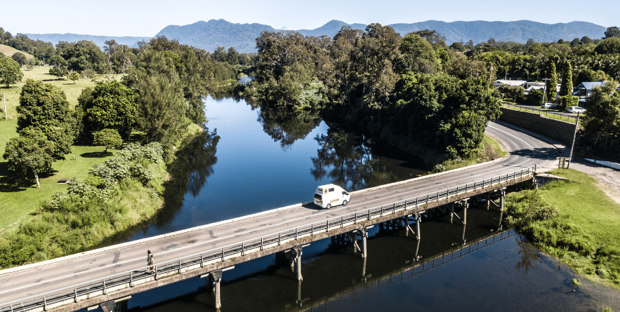 Campervan driving over bridge in Australia